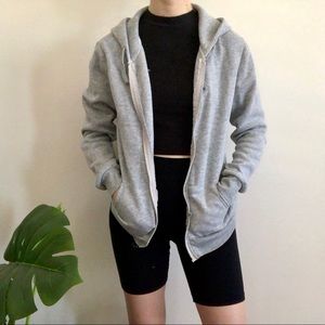 Grey zip up hoodie with wings on the back
